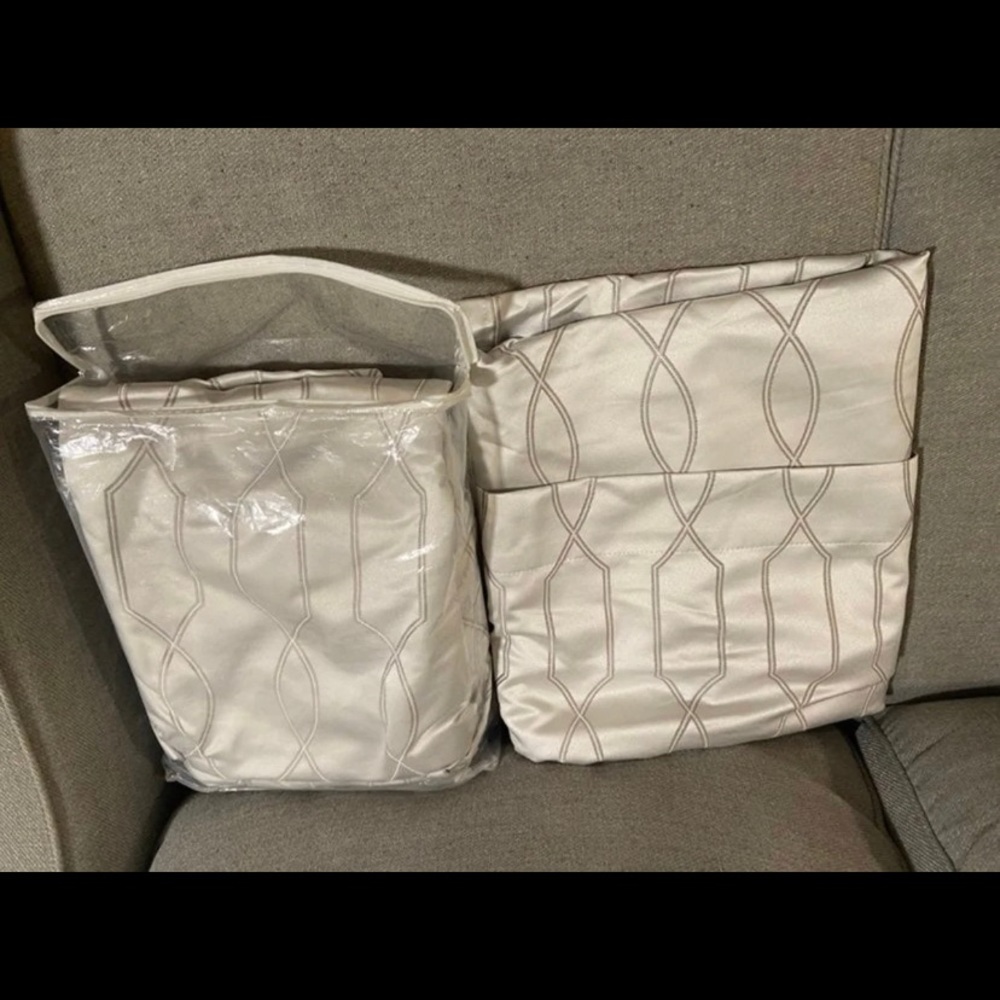Two 96 inch long curtain panels (silver). Like new condition